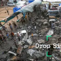 Palestinians inspect the targeted area on the tents housing displaced civilians after Israeli attacks in the courtyard of Al-Aqsa Martyrs Hospital in Deir Al Balah, Gaza on October 14, 2024. Photo by Ashraf Amra/Anadolu via Getty Images